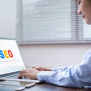 Shows a woman looking at SEO. Represents how seo services for private practice owners can help