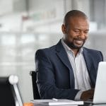african american man smiles because he improved his readability and SEO and is ranking better on search engines. He learned these skills from Simplified SEO consulting