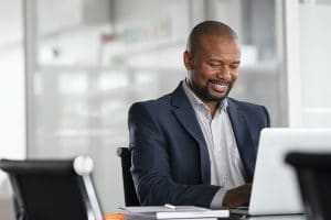 african american man smiles because he improved his readability and SEO and is ranking better on search engines. He learned these skills from Simplified SEO consulting