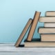 Shows a stack of books. Represents how books can help assist you and your business in guiding you through SEO