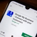 Google My Business on phone screen. This is just one example of SEO tools that can boost your online presence. Learn more here.