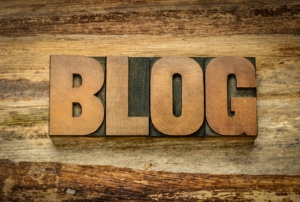 A photo of wood carved out to spell "Blog" in big block letters. This photo represents the importance of blogging and adding content to a private practice website. Through search engine optimization for counselors, you can learn how to improve blogging for your site. | 65202 | 65203