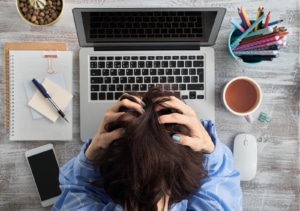 A woman holds her head in disappointment as she struggles to resolve a Google My Business issue. We offer support with Google My Business in Counseling. Contact us for advice in how to build SEO for therapists and local SEO for therapists with Simplified SEO Consulting. 65202 
