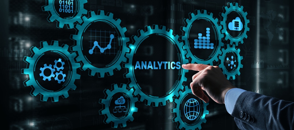 Touch screen displaying analytics while an idividual looks at the data. Understanding analytic data is not as hard as it seems. SEO consultants can help. Learn more here.