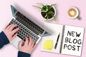 A picture of someone typing on their computer with a plant, coffee and their notebook with the words "New Blog Post". This represents you writing new blogs to boost the SEO of your private practice website. Learn more about how to build SEO for therapists with Simplified SEO Consulting!.