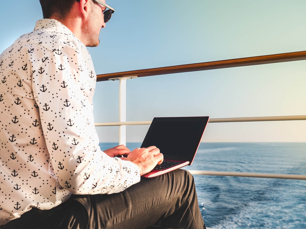 Man blogging on the Carnival Liberty ship for SEO cruise to learn how to do blogging for therapists in Florida and throughout the United States.