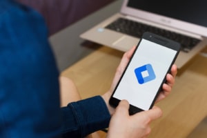 A person holds their phone with the Google Tag Manager logo on screen. Contact an SEO specialist for therapists to learn more about how to improve private practice SEO today.