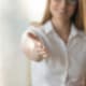 Image of a mental health professional in a white shirt reaching out her hand. Showing how you can help your ideal clients and boost your SEO