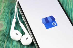 A close up of a phone with the Google Business Profile logo. Learn how to use Google Business Profile for therapists and how it can offer support with local SEO for therapists today.