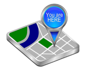 Photo of a map with a "you are here" sign showing the value of knowing how your physical location relates to other businesses when optimizing your private practice website for Local SEO.