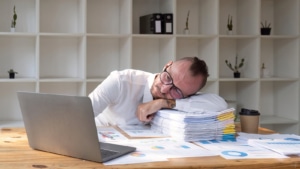 Image of a man, exhausted representing the frustration that SEO can cause someone, but we are here to help! SEO for Therapists and much more can be found here!