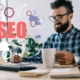 Photo of a man smiling and writing with the graphic word SEO beside him. Are you looking for SEO for private practices? Discover how to improve your website's SEO with the help of Simplified SEO Consulting.