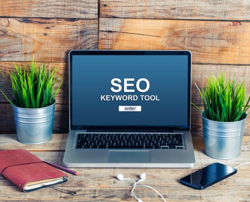 SEO Keyword Tool displayed on laptop screen. Don't let your competitors beat you! Learn law firm SEO today.