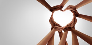 A group of people makes a heart with their hands. Learn more about the best therapist directories by searching for "therapist directory" today.  
