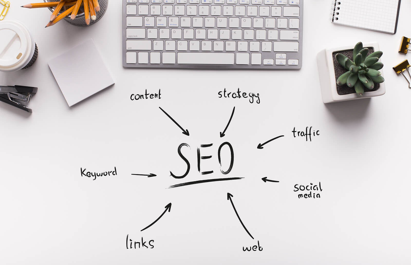 The words SEO written in black ink on a desk in front of a keyboard. Having troubling grasping SEO in healthcare. Let us help you become better at knowing SEO strategy for the healthcare industry