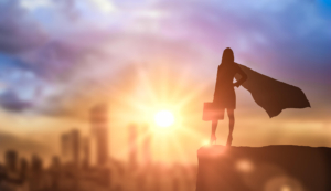 Shows a superhero holding a briefcase looking over the city. Represents how SEO and storybrand can enhance how to rank on google for therapists.