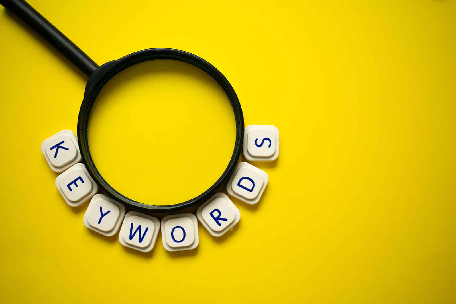 Letters spelling out keywords around a magnifying glass on a yellow background. Want to improve your healthcare SEO? We can help you understand local SEO for healthcare providers. Visit us today!