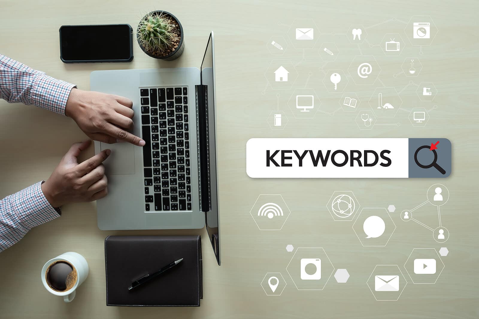 Keywords in search bar while a person types on a computer. Keywords are an important factor for personal injury SEO. Learn more SEO techniques for your law firm.