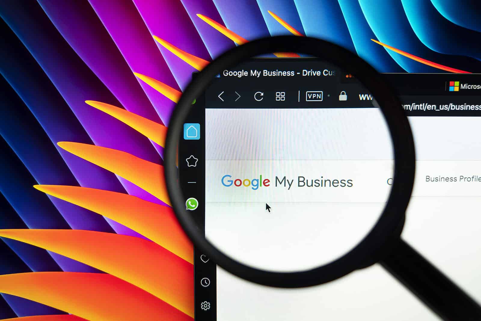 A magnifying glass hovering over Google My Business logo. There are several things that go into good SEO. Learn more from Simplified SEO Consulting.