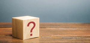 An image of a wooden block with a question mark. Learn tips for improving SEO for online therapy and improving private practice SEO. Search for search engine optimization for counselors for support today. 