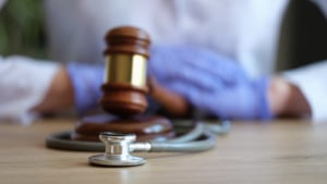 A stethoscope wrapped around a gavel. We offer SEO for personal injury lawyers to help you boost your online presence. Discover more ways to find ideal clients here.