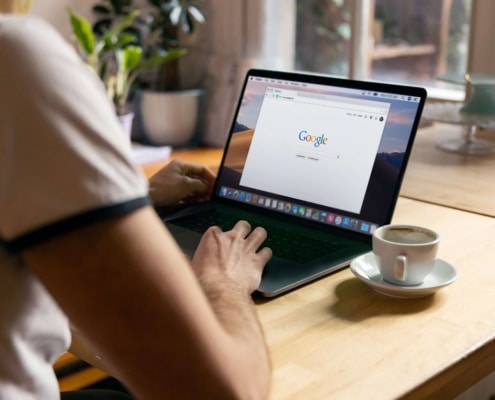 Image of an individual working on a laptop at a table. Discover how SEO can benefits therapists and how Simplified SEO Consulting can help you!