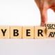 Cyber Risk on wooden blocks. If you are interested in learning more about password protection and scams, contact us today!
