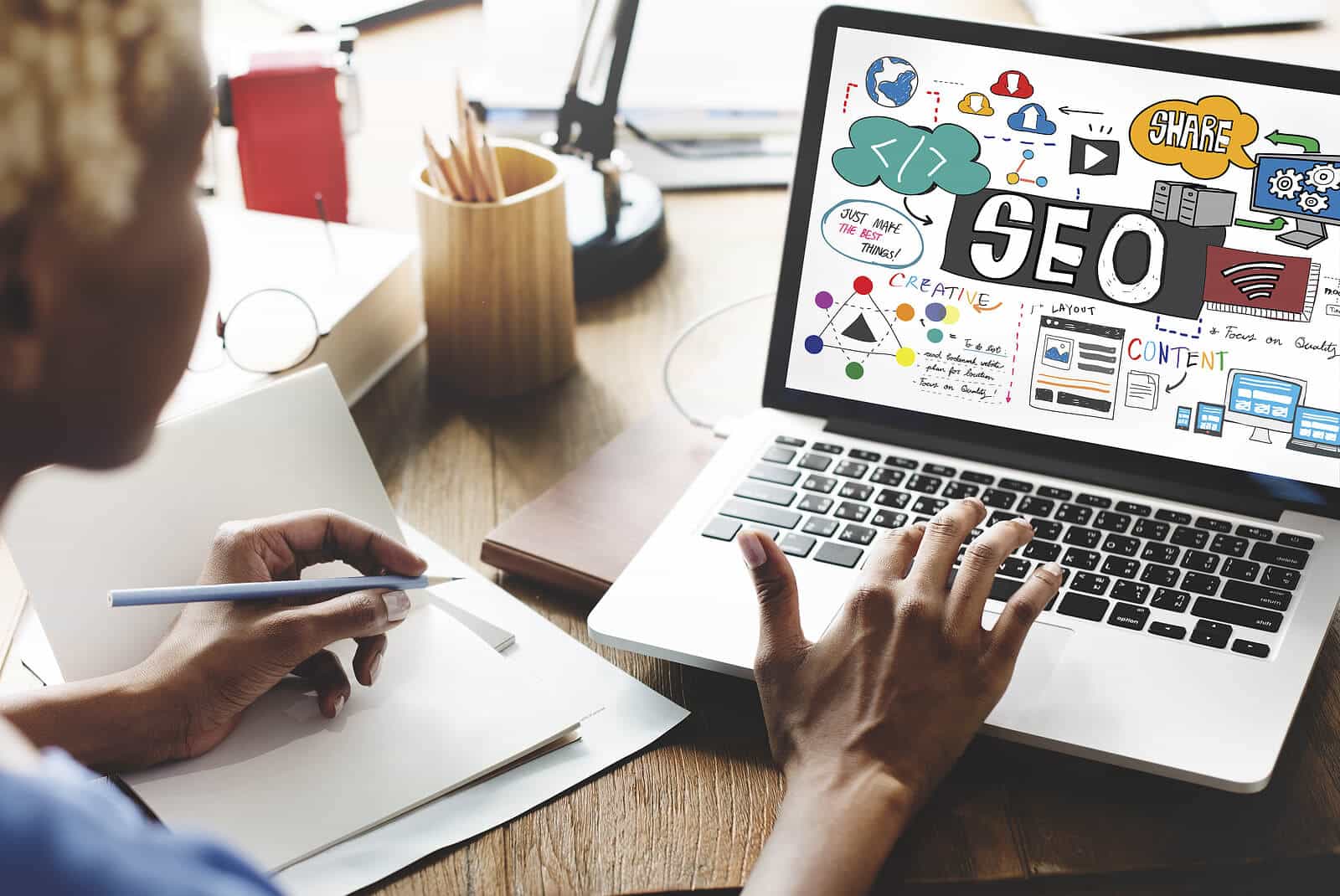 A woman looks and types on a laptop with the words SEO displayed on her screen. Want to grow your business but do not know how to implement SEO? Our team members can help you incorporate SEO in mental health to improve your business today!
