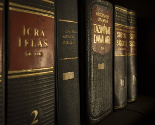 Legal books on a shelf. Learn the best marketing strategy for personal injury lawyers here!