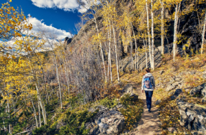 Shows someone hiking in Colorado. Represents how local seo can help with seo for mental health and private practice seo.