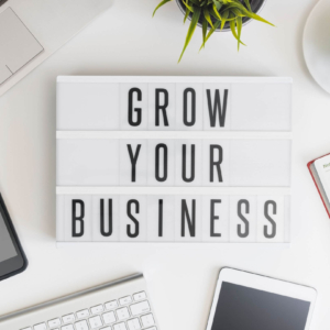 Shows an office sign that says "Grow Your Business". Represents how seo keywords for therapists can help with seo for private practices.