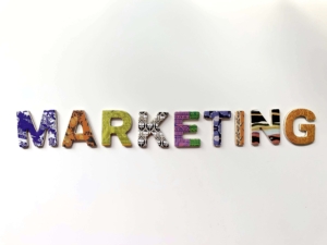 "Marketing" spelled out in different textiles. If you want to learn how to do SEO for free, sign up for our email training! Get started today. 