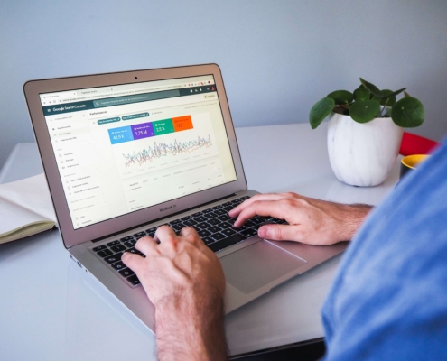 Image of a man typing on a laptop. If you want to help enhance your private practice SEO, discover how Simplified SEO Consulting can help you.