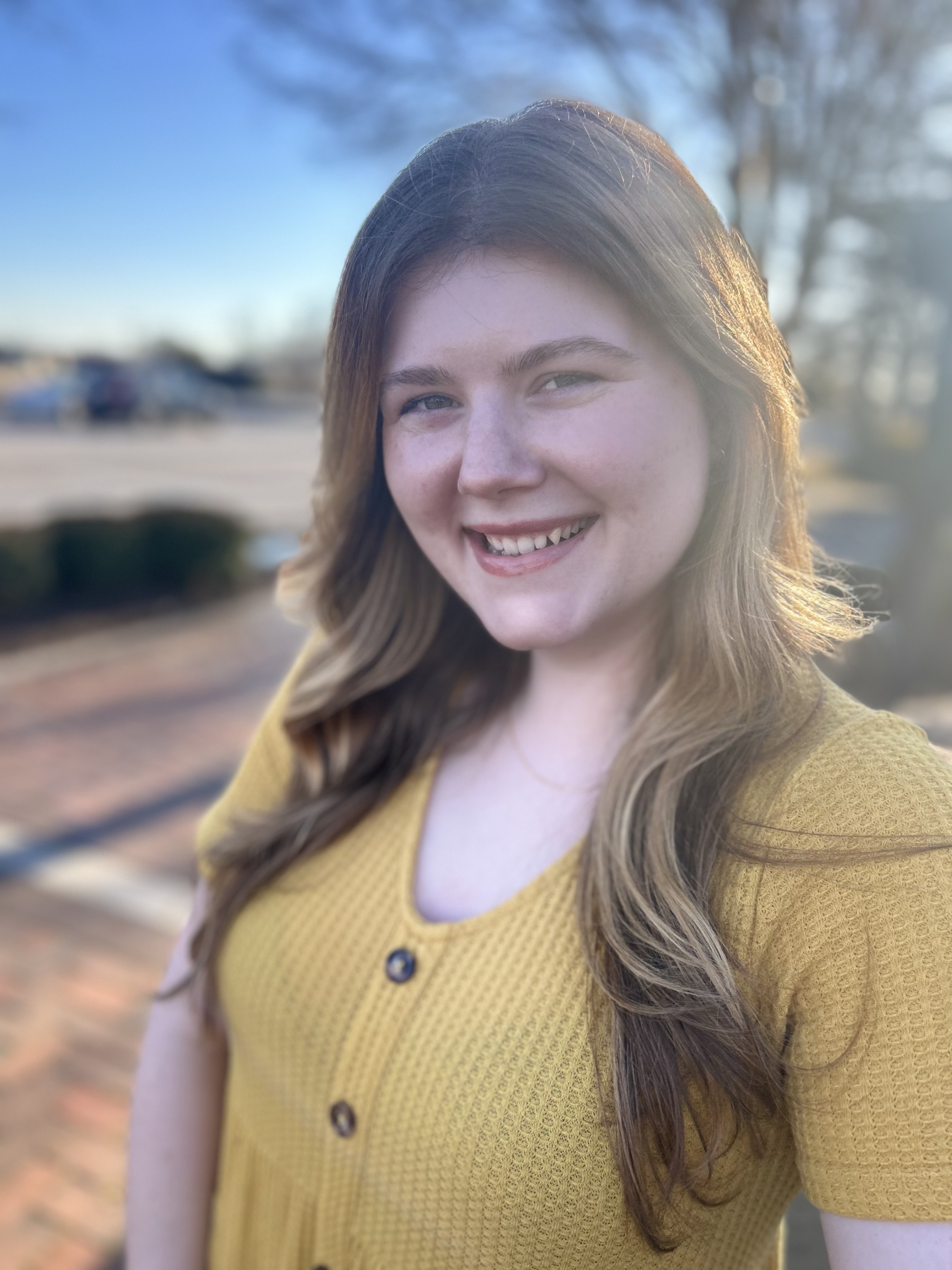 Search visibility specialist at Simplified SEO Consulting smiling, representing expert guidance and strategy in SEO help for therapists.