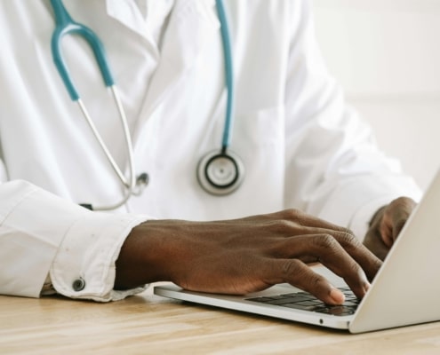 Doctor working on local SEO for doctors strategies to improve medical practice visibility and SEO for doctors online