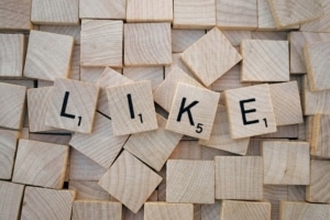 "LIKE" spelled out on scrabble pieces. Building an online presence through social media can feel overwhelming. Our social media manager can help simplify it & find your ideal clients.