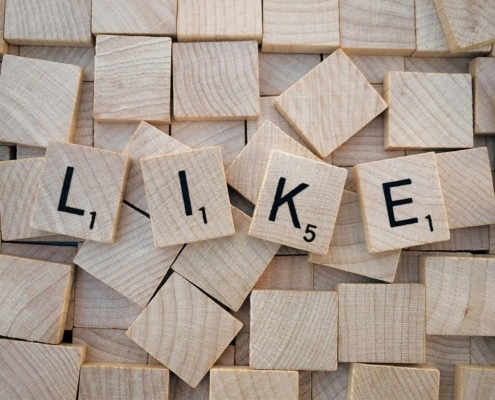 "LIKE" spelled out on scrabble pieces. Building an online presence through social media can feel overwhelming. Our social media manager can help simplify it & find your ideal clients.