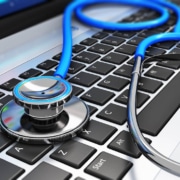 Image of a stethoscope lying on a laptop keyboard. Are you interested in how seo for functional medicine works? Discover the benefits of seo for holistic health and wellbeing providers and how it can help you attract your ideal patients.