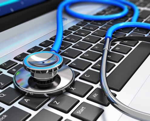 Image of a stethoscope lying on a laptop keyboard. Are you interested in how seo for functional medicine works? Discover the benefits of seo for holistic health and wellbeing providers and how it can help you attract your ideal patients.
