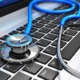 Image of a stethoscope lying on a laptop keyboard. Are you interested in how seo for functional medicine works? Discover the benefits of seo for holistic health and wellbeing providers and how it can help you attract your ideal patients.