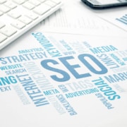 A word cloud highlights SEO, ranking, and marketing with a keyboard nearby. Curious about SEO for holistic health and wellbeing? A trusted medical practices SEO consultant can guide you in boosting visibility and connecting with more ideal clients.