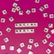 Social media spelled out on scrabble pieces on a magenta background. Our social media specialist can tie your social media strategy to your SEO strategy. Learn more by reading our blog here!