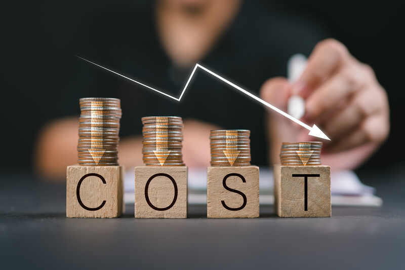 Cost Savings – affordable SEO – ethical marketing – outreach efficiency – Illinois, Florida, Washington, United States Stacks of coins arranged over wooden blocks spelling COST with downward arrow showing reduced marketing expenses through ethical SEO services, United States.