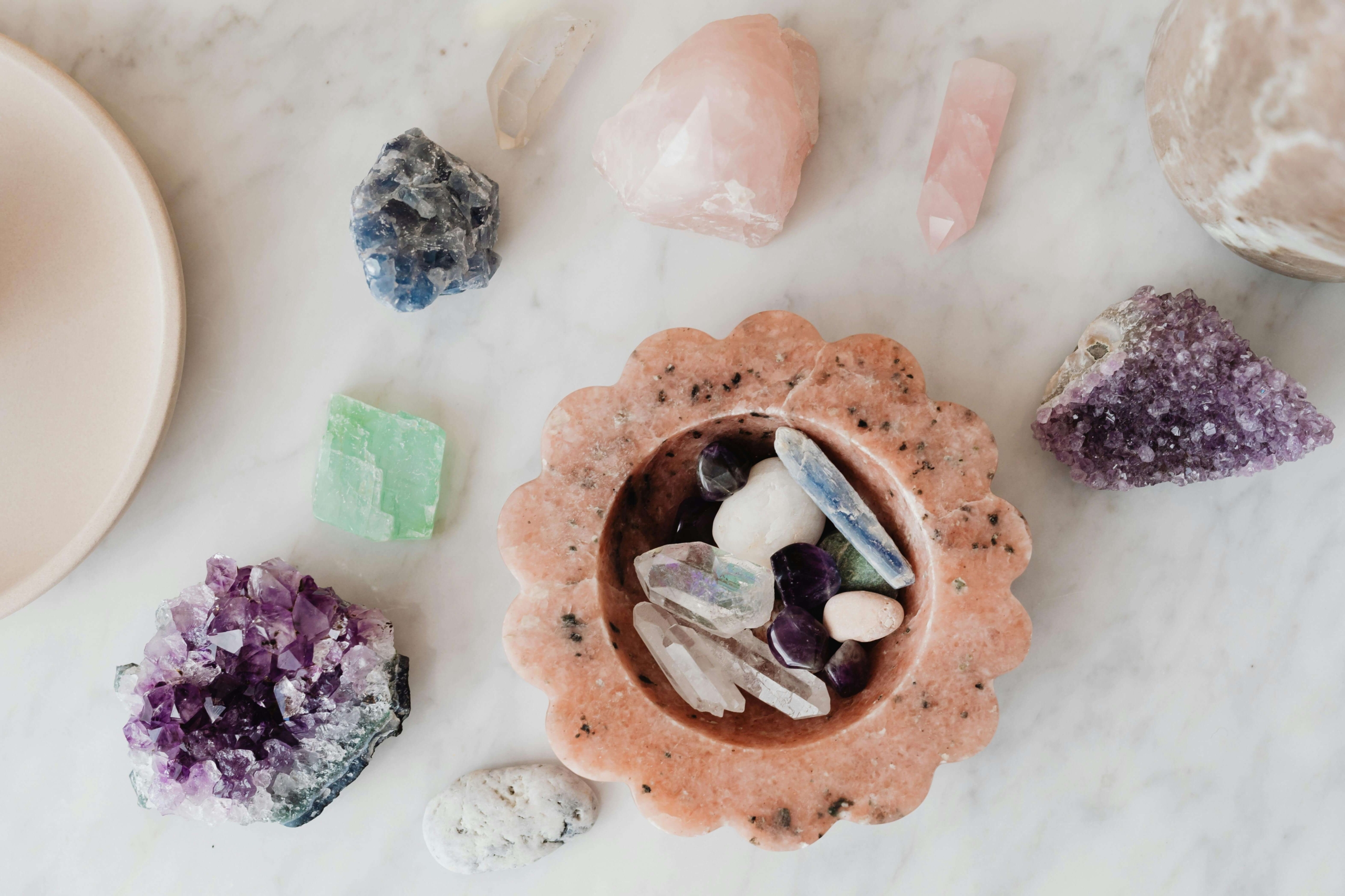 A collection of crystals and healing stones, highlighting the types of wellness practices that benefit from alternative healing SEO strategies.
