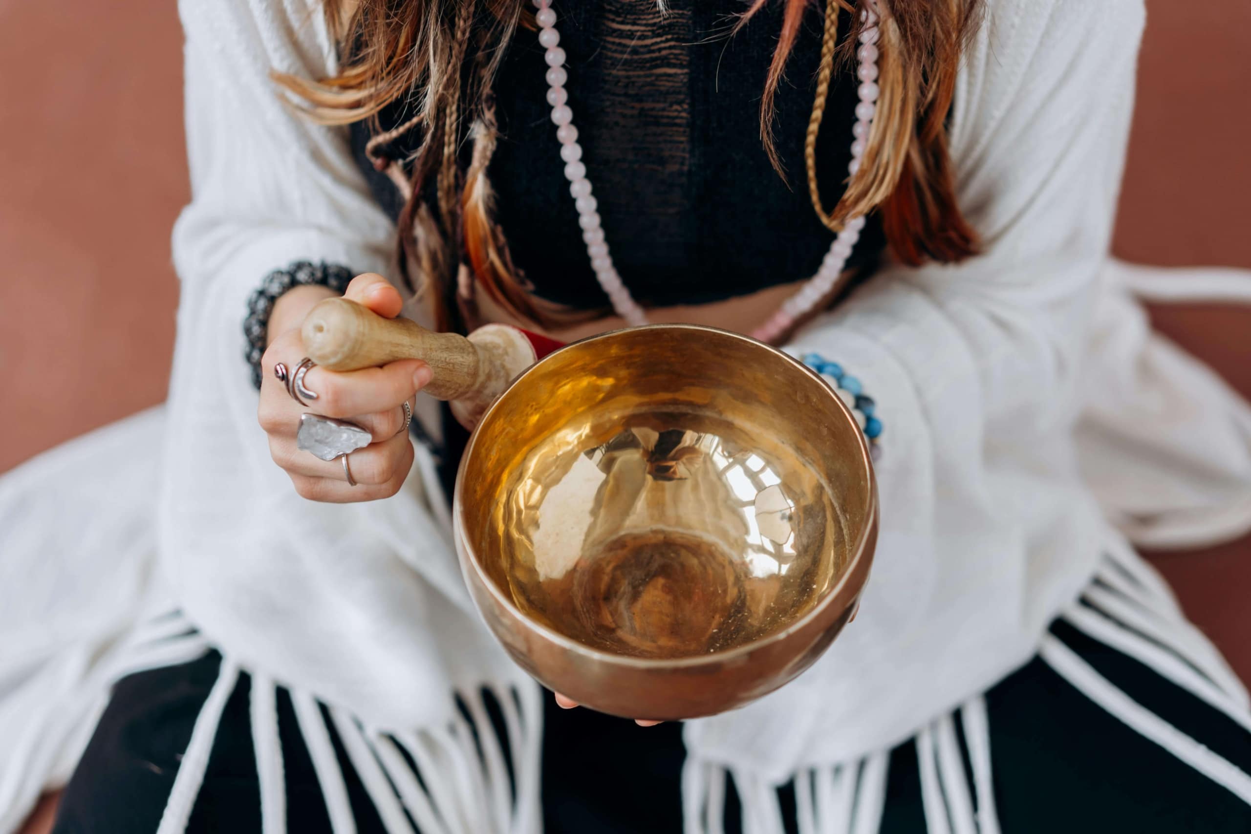 A person holds a singing bowl in a peaceful space, illustrating mindfulness and sound healing. Wellness SEO empowers holistic businesses to reach the right clients online, with guidance from a skilled SEO consultant.