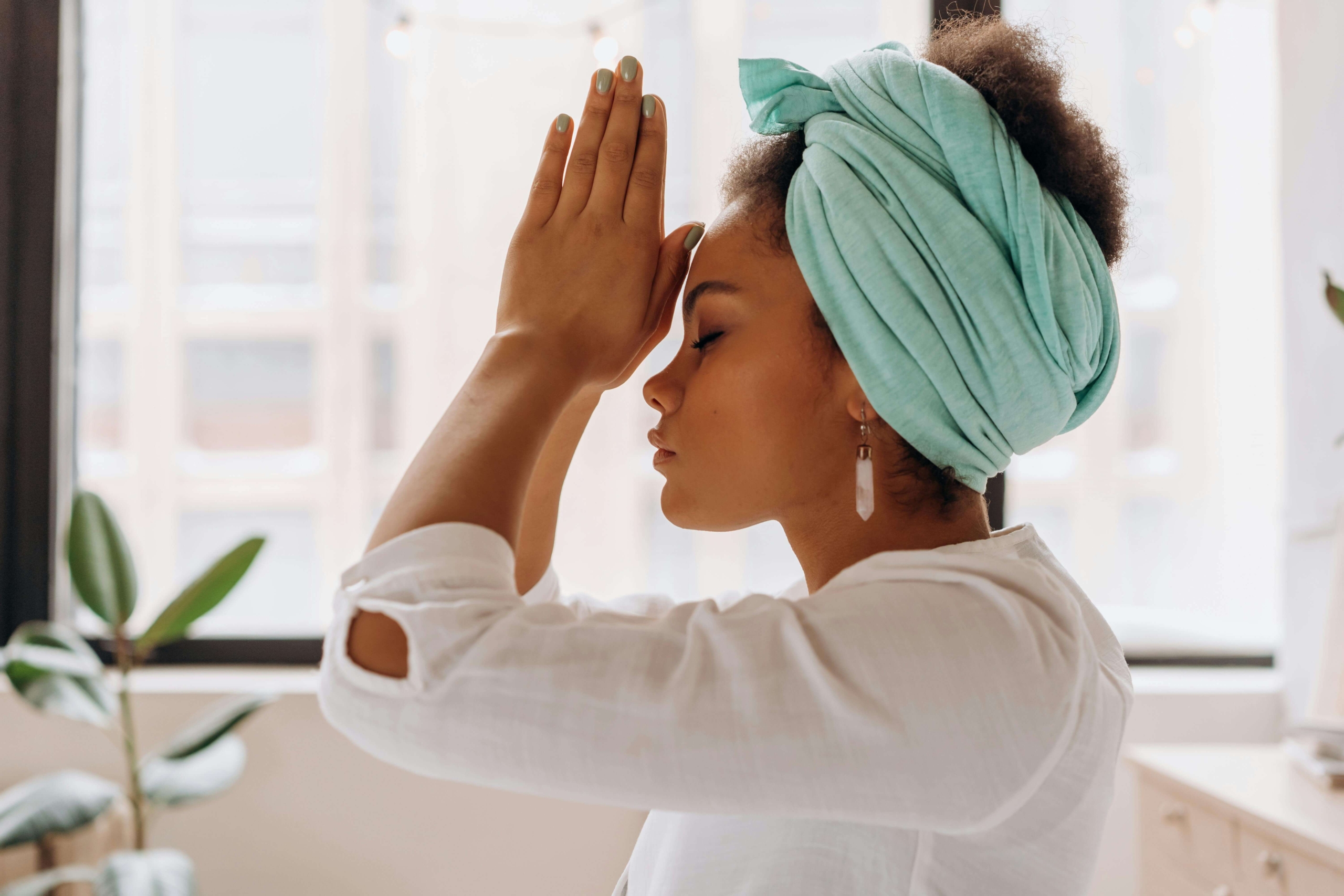 A woman practicing meditation in a peaceful studio, symbolizing how alternative healing SEO connects mindful practitioners with people seeking holistic care.
