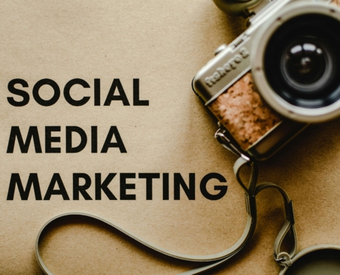 "Social media marketing" near an old camera. Our social media marketing can help your ideal clients find you online. Learn more here from our social media manager.