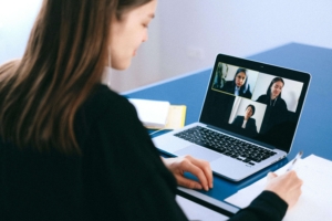 A woman talking to 3 team members over an online meeting. Social media & SEO can work together in the right strategy. Get started with our social media manager for therapists today.