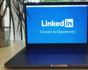 LinkedIn's loading screen on a laptop. Social media marketing for therapists is a way to get your voice out there for clients. Begin social media management with our team today.
