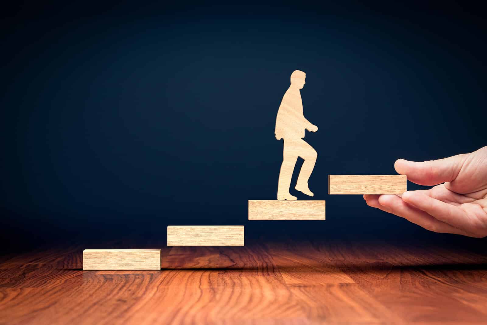 A wooden cutout figure climbs a staircase of planks. Are you looking for someone to help place each building block of your online presence strategically? SEO services for therapists give your private practice the guided support it needs to reach more people.